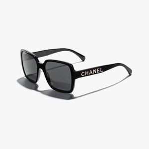 CHANEL Elegant Black and Gold Sunglasses